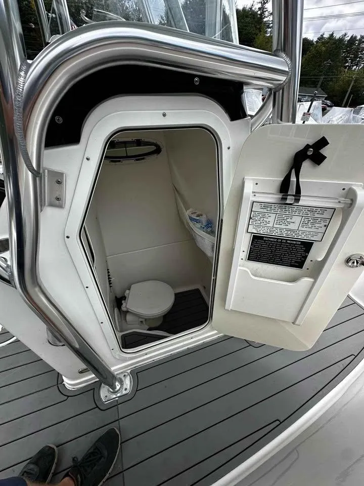 Slide: The Image of 2015 Century 2600 CC boat interior with open hatch and visible toilet. - 9