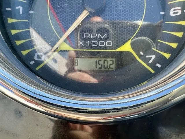 Slide: The Image of Close-up of a 2018 Sea Ray SPX 210 tachometer displaying 1502 RPM. - 15