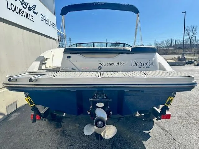 Slide: The Image of 2018 Sea Ray SPX 210 boat, rear view, with "You should be Dancin" text on the back. - 4