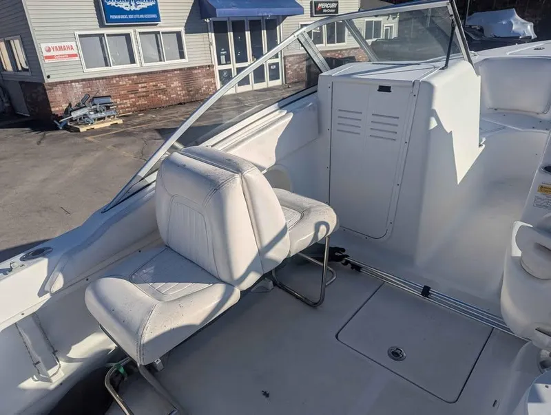 Slide: The Image of 2012 Sea Fox 236CC Pro Series boat interior with white seating and console. - 10