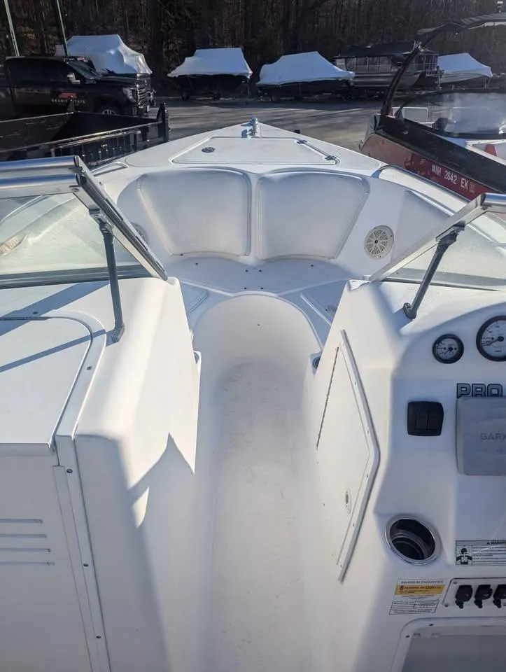 Slide: The Image of 2012 Sea Fox 236CC Pro Series boat interior with console and seating area. - 11