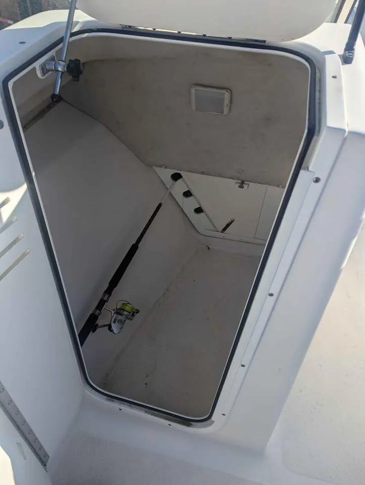 Slide: The Image of 2012 Sea Fox 236CC Pro Series boat storage compartment, open and empty. - 17