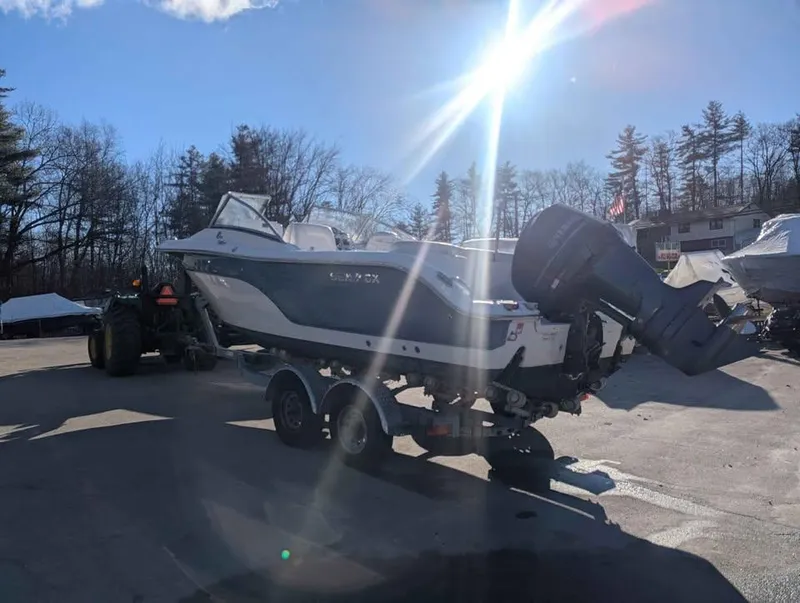 Slide: The Image of 2012 Sea Fox 236CC Pro Series boat on trailer under bright sunlight. - 2