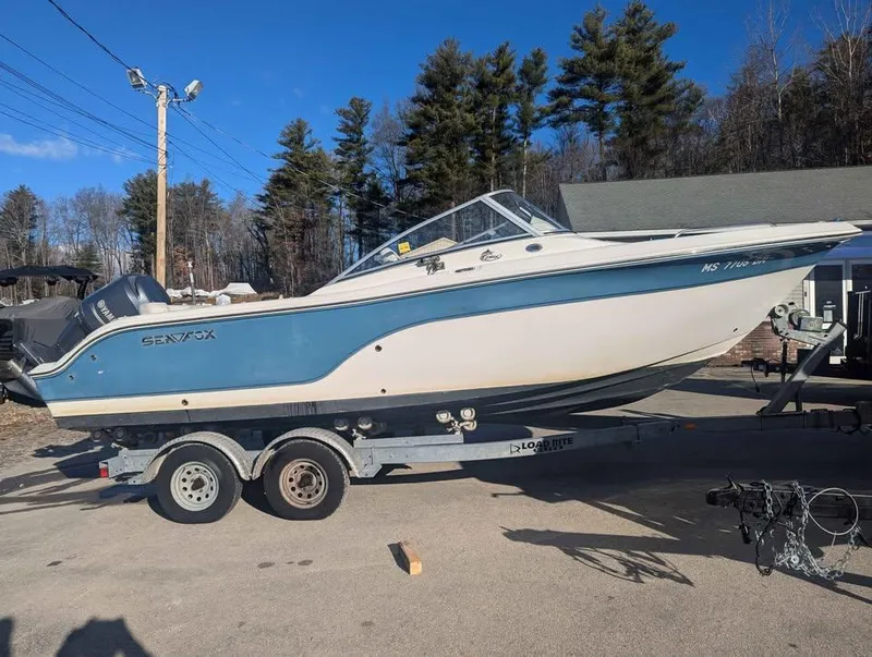 Slide: The Image of 2012 Sea Fox 236CC Pro Series boat on trailer, parked outdoors. - 5