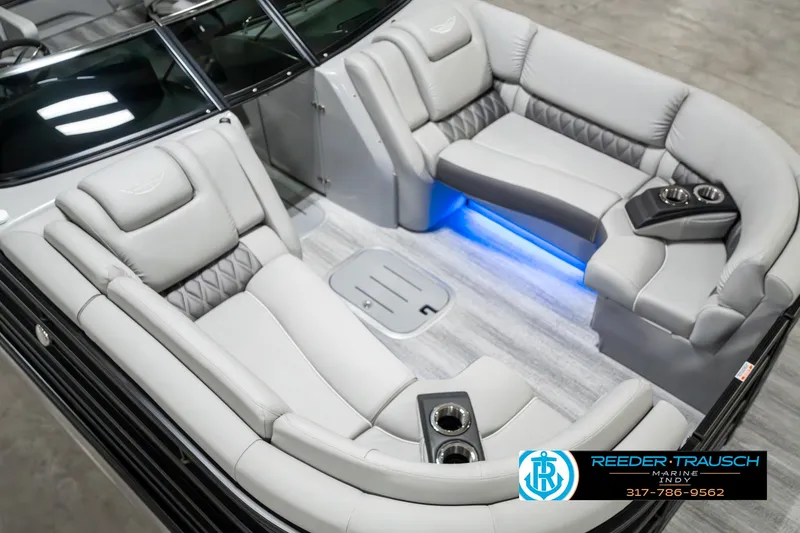 Slide: The Image of 2025 Bennington 23 RSBWA boat interior with luxurious seating and ambient lighting. - 12