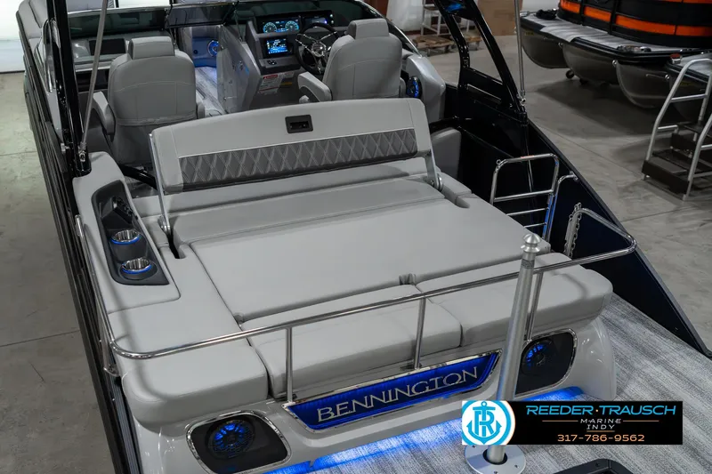Slide: The Image of 2025 Bennington 23 RSBWA boat interior with luxurious seating and modern dashboard. - 14