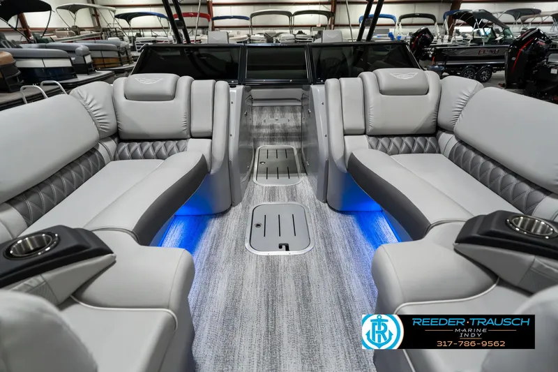 Slide: The Image of 2025 Bennington 23 RSBWA boat interior with luxurious seating and ambient lighting. - 15