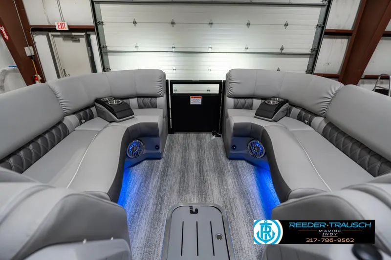 Slide: The Image of Luxurious interior of 2025 Bennington 23 RSBWA pontoon boat with LED lighting and plush seating. - 20