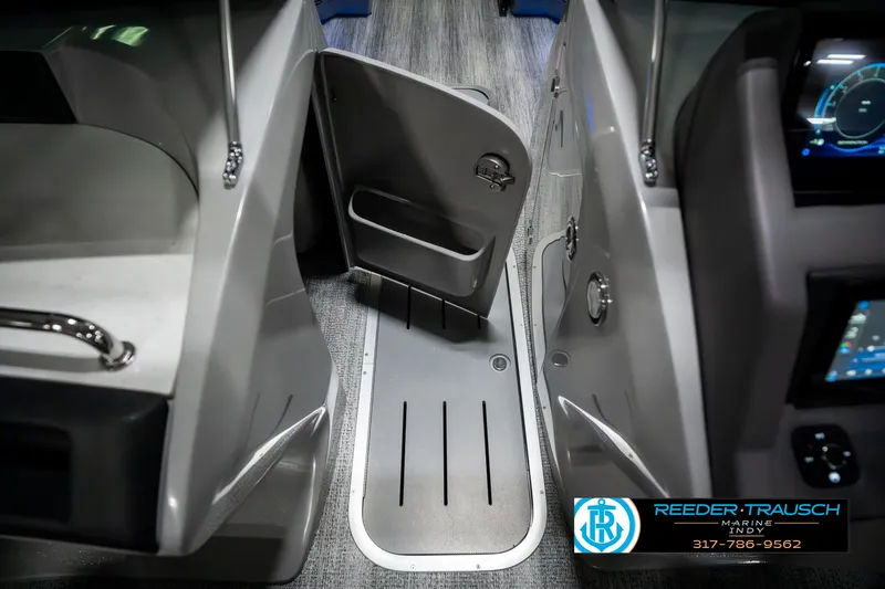 Slide: The Image of Interior view of 2025 Bennington 23 RSBWA boat with open storage compartment. - 26
