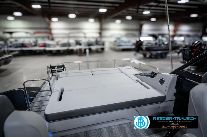 Slide: The Image of 2025 Bennington 23 RSBWA boat interior with luxurious seating in showroom. - 31