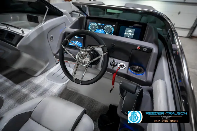 Slide: The Image of 2025 Bennington 23 RSBWA boat interior with modern dashboard and steering wheel. - 34