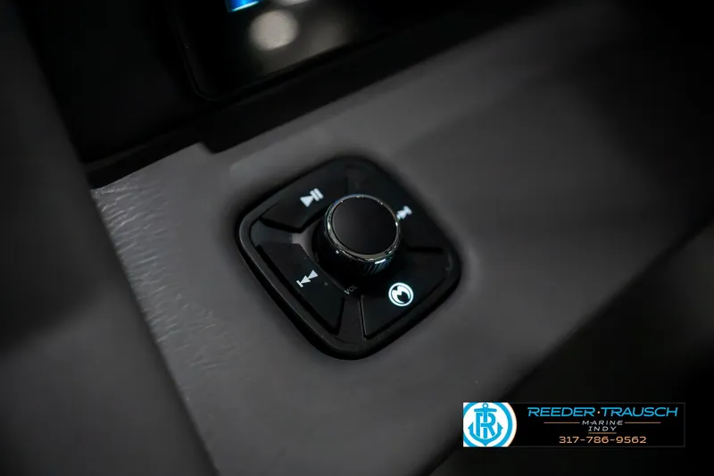 Slide: The Image of Control knob in 2025 Bennington 23 RSBWA boat, featuring media playback buttons. - 37