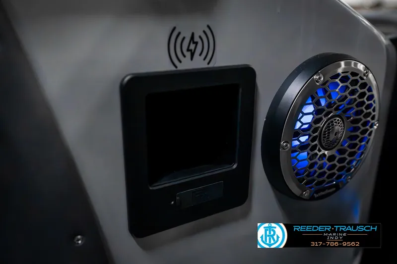 Slide: The Image of 2025 Bennington 23 RSBWA boat interior with speaker and wireless charging pad. - 41