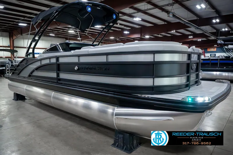 Slide: The Image of 2025 Bennington 23 RSBWA pontoon boat in showroom, sleek design, modern features. - 5