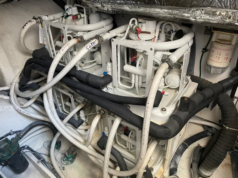 Slide: The Image of Engine room of 2005 Tiara Yachts 4400 Sovran with complex piping system. - 21