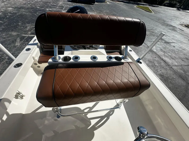 Slide: The Image of Brown leather seating on 2022 Pathfinder 2005 TRS boat, featuring diamond stitching and cup holders. - 4