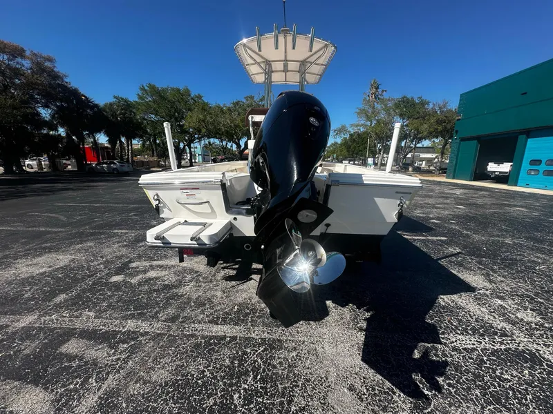 Slide: The Image of Rear view of 2022 Pathfinder 2005 TRS boat with outboard motor in sunny setting. - 7