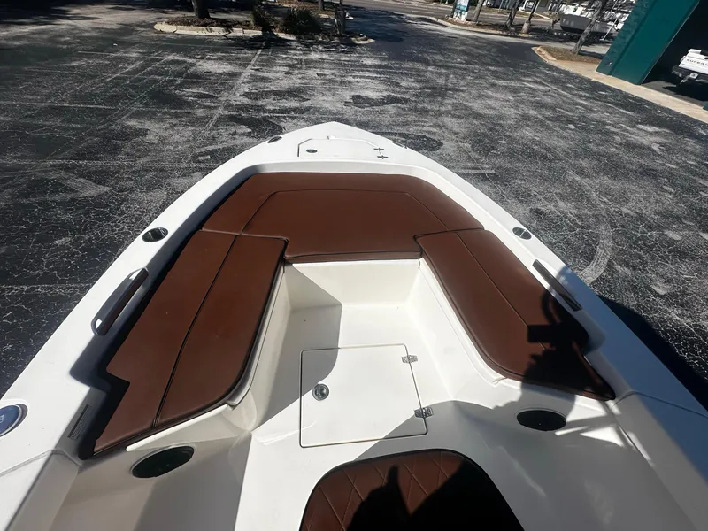 Slide: The Image of Bow seating area of a 2022 Pathfinder 2005 TRS boat with brown cushions. - 8