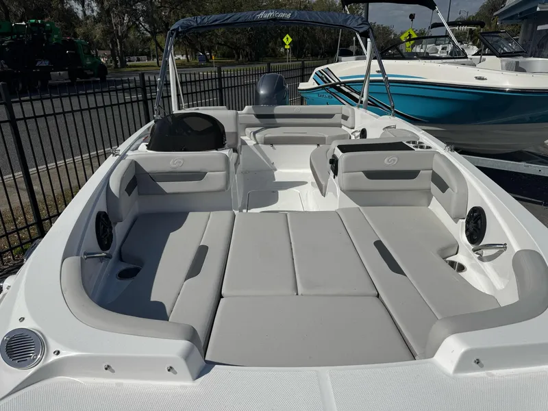 Slide: The Image of 2024 Hurricane SunDeck Sport 185 OB boat interior with gray seating and open deck layout. - 1