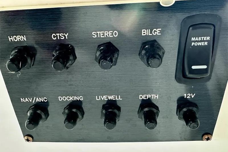 Slide: The Image of Control panel of 2025 Hurricane SunDeck Sport 185 OB boat with various switches. - 10