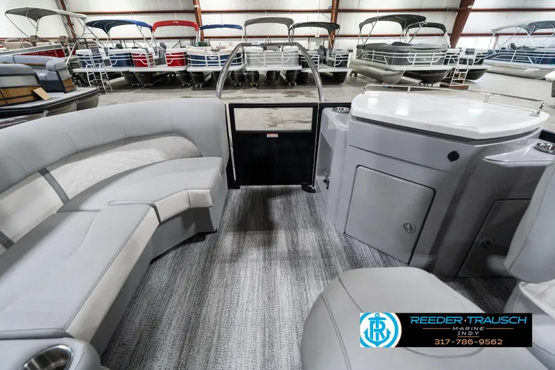 Slide: The Image of 2025 Bennington 25 LPD pontoon boat interior with gray seating and modern design. - 18