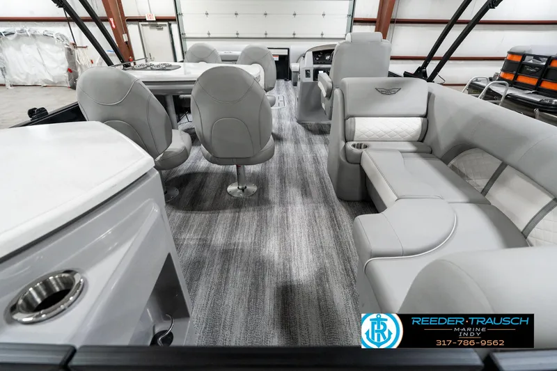 Slide: The Image of Luxurious interior of 2025 Bennington 25 LPD pontoon boat with plush seating. - 19