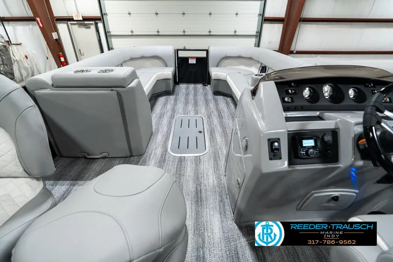 Slide: The Image of Interior of 2025 Bennington 25 LPD boat with modern seating and control panel. - 20