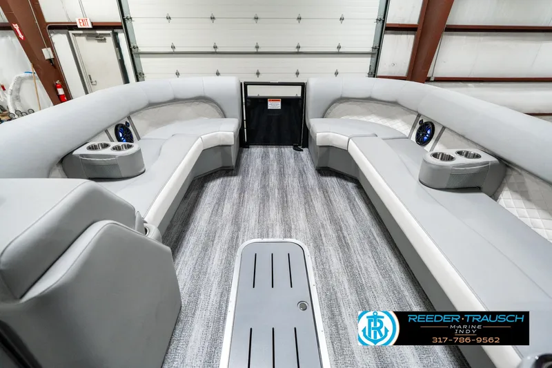 Slide: The Image of Interior of 2025 Bennington 25 LPD pontoon boat with gray seating and flooring. - 21