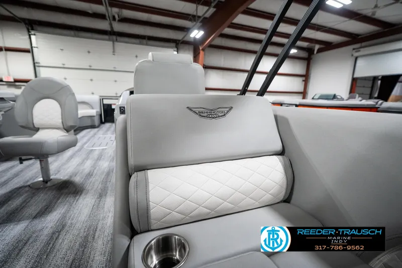 Slide: The Image of 2025 Bennington 25 LPD boat interior with plush seating and cup holder. - 28
