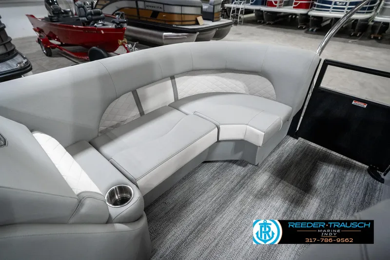 Slide: The Image of 2025 Bennington 25 LPD boat interior with gray seating and cup holder. - 30