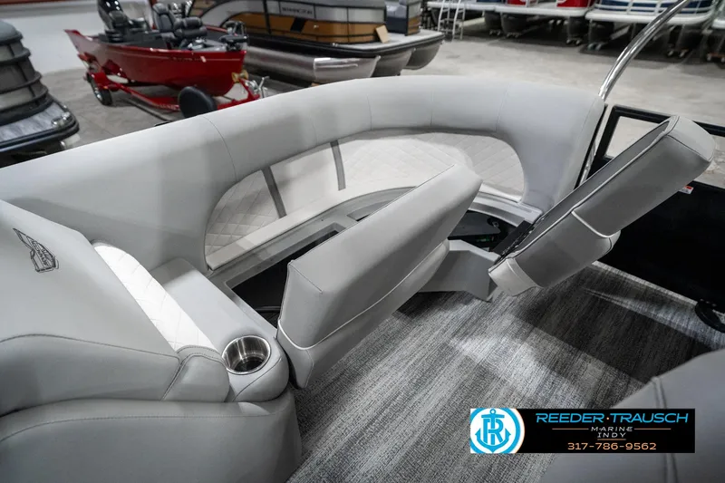 Slide: The Image of Interior of 2025 Bennington 25 LPD boat with gray seating and cup holder. - 31