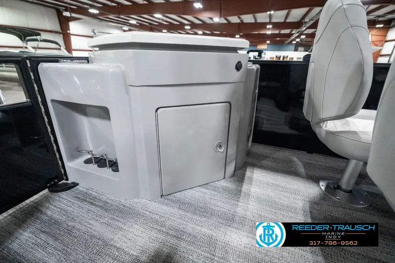 Slide: The Image of 2025 Bennington 25 LPD boat interior with storage compartment and seating. - 32