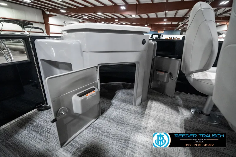 Slide: The Image of 2025 Bennington 25 LPD boat interior with storage compartments and seating. - 33
