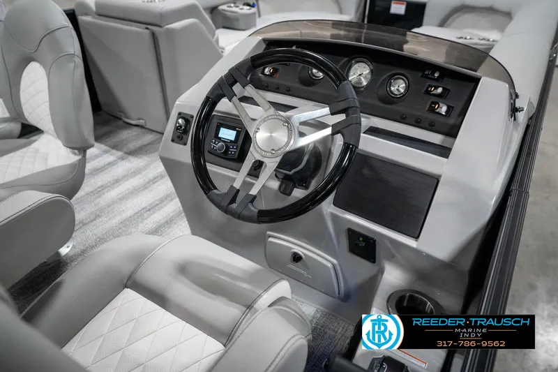 Slide: The Image of 2025 Bennington 25 LPD boat interior with modern steering console and luxurious seating. - 34