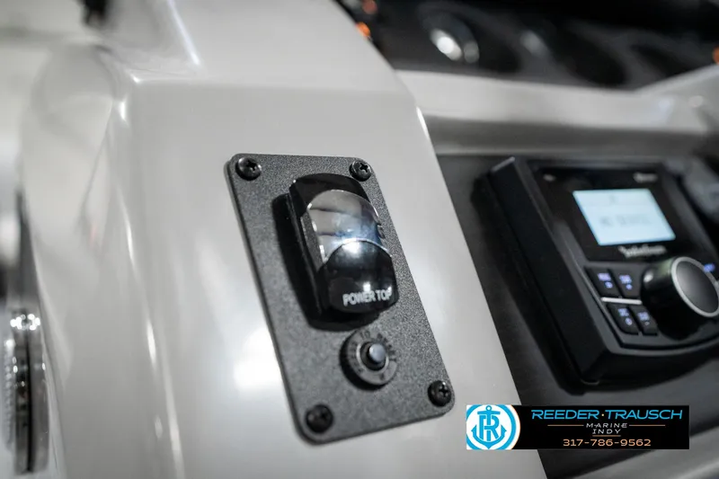 Slide: The Image of Control panel of 2025 Bennington 25 LPD boat with power top switch. - 37