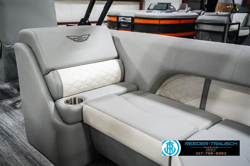 Slide: The Image of 2025 Bennington 25 LPD boat interior with luxurious seating and cup holder. - 44