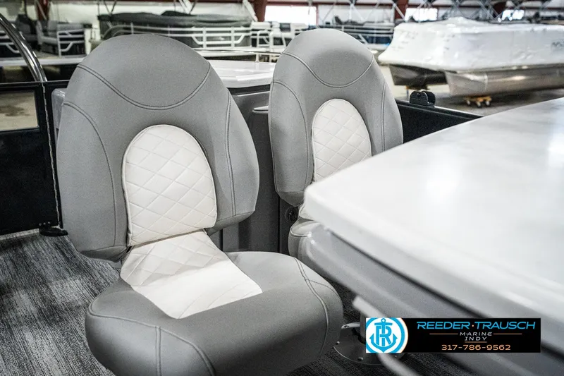 Slide: The Image of 2025 Bennington 25 LPD boat interior with gray and white cushioned seats. - 46