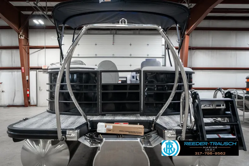 Slide: The Image of 2025 Bennington 25 LPD pontoon boat in warehouse setting. - 9