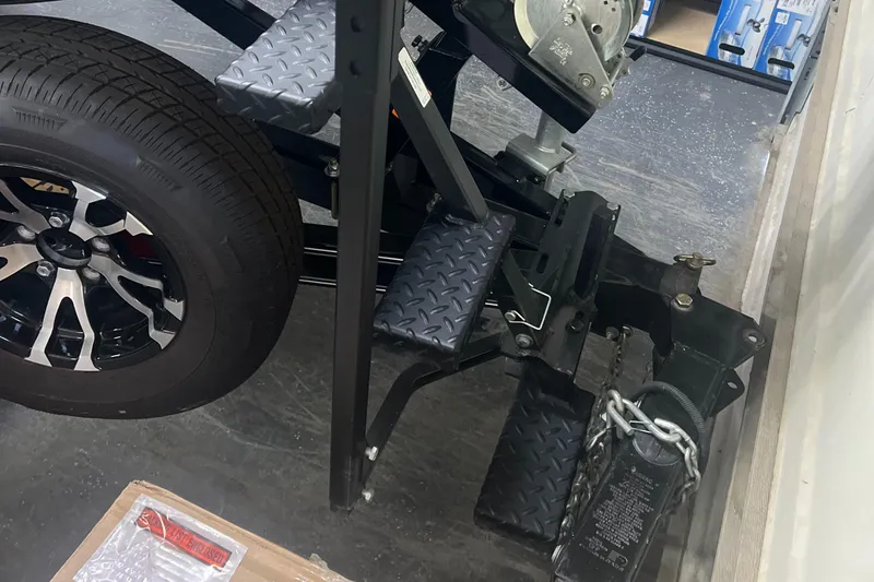 Slide: The Image of 2016 Polar Kraft Bass TX 195 Pro trailer hitch and tire detail. - 14
