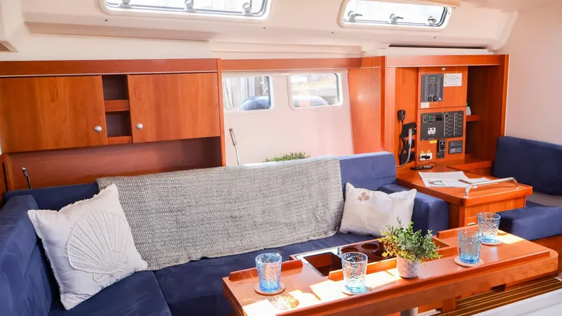 Slide: The Image of Interior of 2018 Hanse 505 yacht with cozy seating and wooden finishes. - 14
