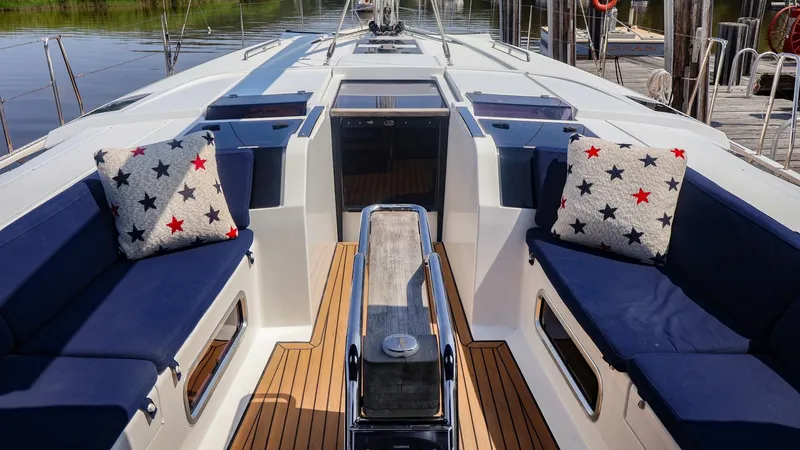 Slide: The Image of Luxurious 2018 Hanse 505 yacht interior with blue seating and star-patterned cushions. - 2