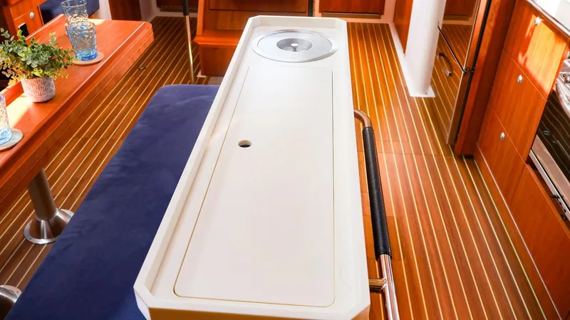 Slide: The Image of Interior of 2018 Hanse 505 yacht with sleek wooden flooring and modern furnishings. - 20