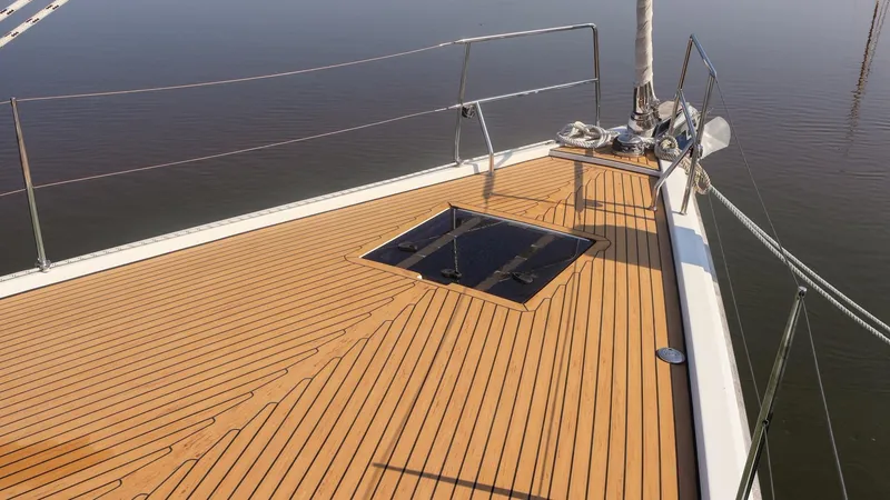 Slide: The Image of 2018 Hanse 505 yacht deck with sleek wooden finish and modern design. - 3