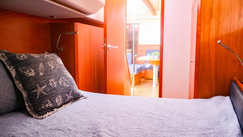 Slide: The Image of Cabin interior of 2018 Hanse 505 yacht with cozy bedding and wooden finish. - 31