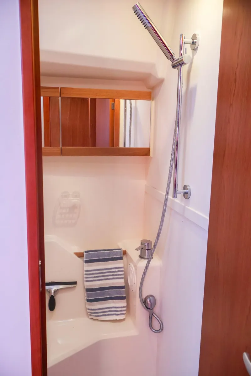 Slide: The Image of 2018 Hanse 505 yacht bathroom with shower and striped towel. - 34