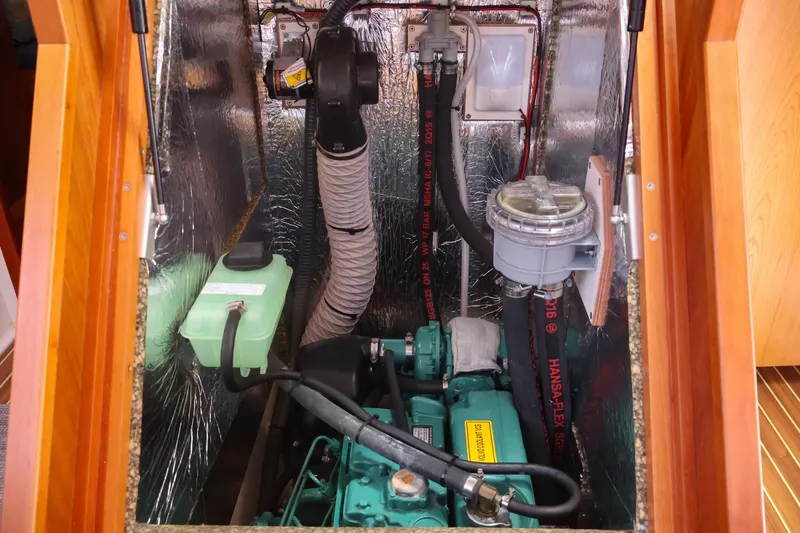 Slide: The Image of Engine compartment of 2018 Hanse 505 yacht, showcasing mechanical components and insulation. - 37