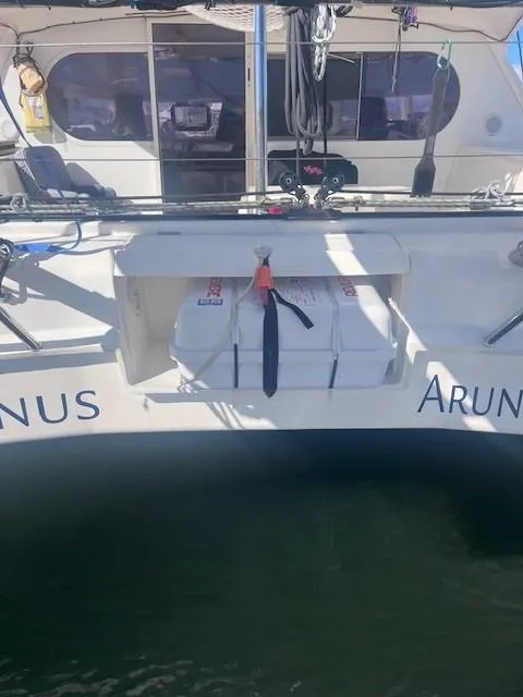 Slide: The Image of Nautitech 402 catamaran, 2011 model, docked with visible life raft storage. - 14