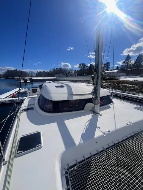 Slide: The Image of 2011 Nautitech 402 catamaran docked under clear blue sky. - 20