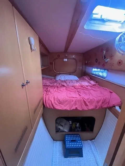 Slide: The Image of Cozy cabin interior of 2011 Nautitech 402 catamaran with bed and storage space. - 27