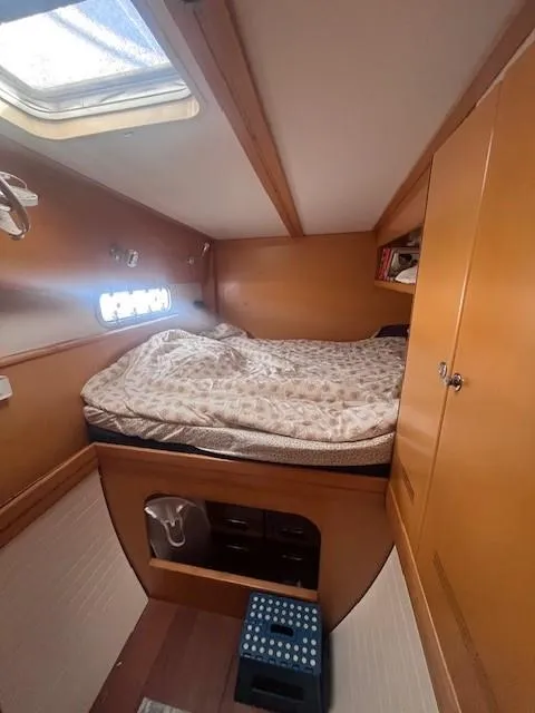 Slide: The Image of Cozy cabin interior of 2011 Nautitech 402 catamaran with bed and storage. - 28